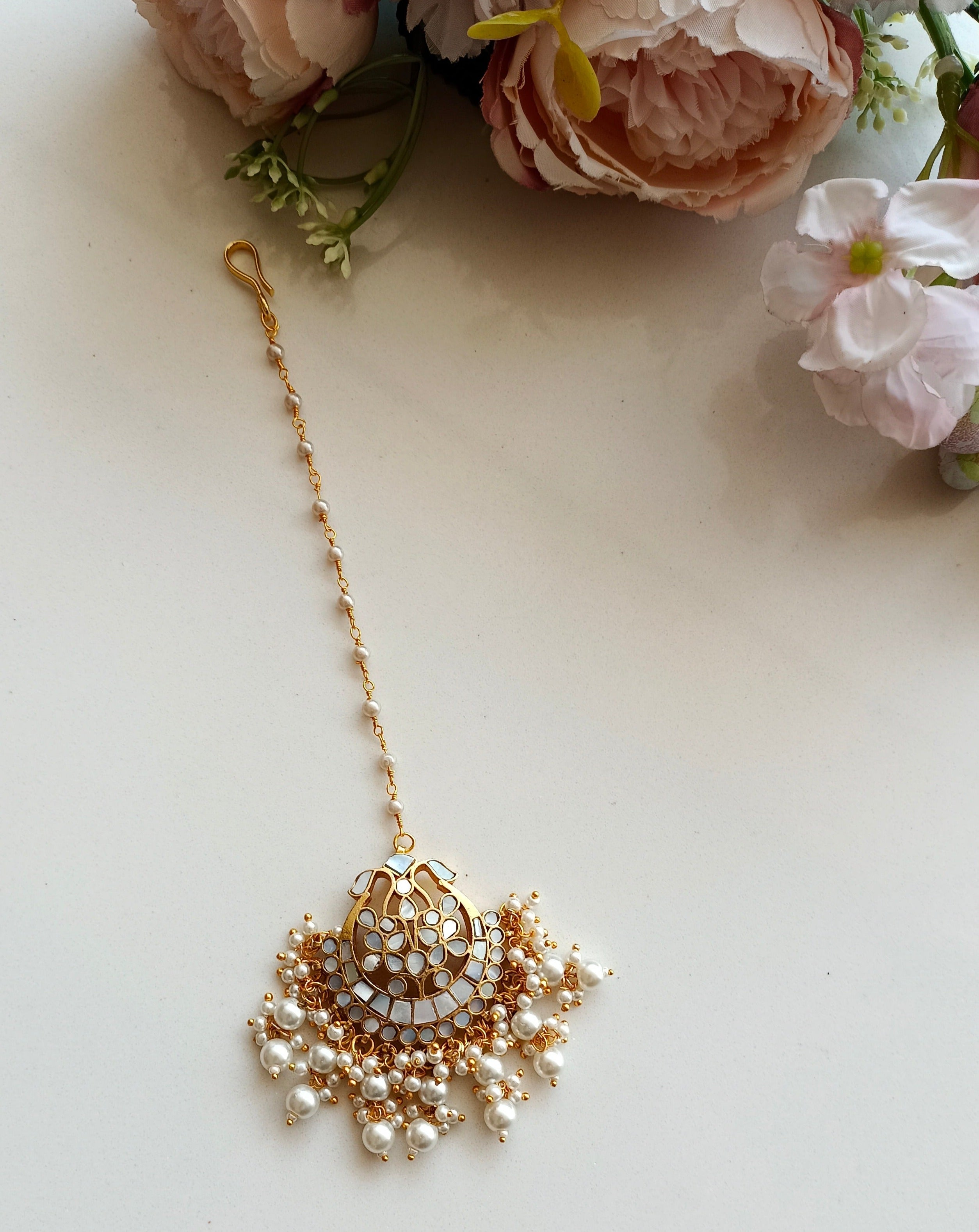 Mother of pearl tikka with pearl drops